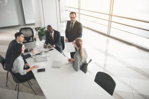 employees taking seat in the boardroom